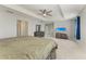 Large primary bedroom featuring carpet floors, neutral walls, recessed lights, and an airy, open floor plan at 1721 Palm Warbler Ln, Ruskin, FL 33570
