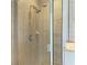 Glass enclosed shower with chrome fixtures and tiled walls at 1721 Palm Warbler Ln, Ruskin, FL 33570