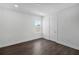 Simple bedroom features hardwood floors, a window and white walls at 17723 Palmiste Dr, Bradenton, FL 34202