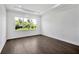 Bright bedroom features recessed lighting, a large window and wood-look flooring at 17723 Palmiste Dr, Bradenton, FL 34202