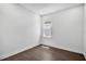 Cozy bedroom features hardwood floors, a window and white walls at 17723 Palmiste Dr, Bradenton, FL 34202
