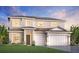 Elegant two-story home featuring a two-car garage, lush lawn, and inviting front entrance at 17723 Palmiste Dr, Bradenton, FL 34202