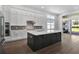 Spacious kitchen with a large island, stainless appliances, and abundant white cabinetry at 17723 Palmiste Dr, Bradenton, FL 34202