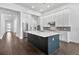 Open kitchen with a large island, stainless appliances, and direct access to other areas of the home at 17723 Palmiste Dr, Bradenton, FL 34202
