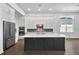 Modern kitchen with a large island, stainless steel appliances, and plenty of cabinet space at 17723 Palmiste Dr, Bradenton, FL 34202