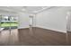 Large living area with hardwood floors, adjacent to outdoor space and backyard at 17723 Palmiste Dr, Bradenton, FL 34202