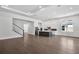 Open-concept living room featuring a modern kitchen with stainless steel appliances at 17723 Palmiste Dr, Bradenton, FL 34202