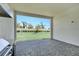 Covered outdoor patio featuring stone flooring, a BBQ grill, and a view of the backyard at 17723 Palmiste Dr, Bradenton, FL 34202