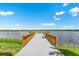 Scenic pier overlooking a serene lake, offering a peaceful escape and stunning views at 17723 Palmiste Dr, Bradenton, FL 34202