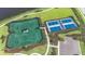 Aerial view of tennis courts, offering residents a place for recreational fun and sports at 17723 Palmiste Dr, Bradenton, FL 34202