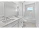 Bright bathroom featuring a double vanity, white subway tiles, and a tub at 17911 Palmiste Dr, Bradenton, FL 34202