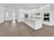 Open kitchen featuring white cabinets, stainless appliances, and island at 17911 Palmiste Dr, Bradenton, FL 34202