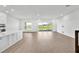 Bright open floor plan with water views and stylish wood flooring at 17911 Palmiste Dr, Bradenton, FL 34202