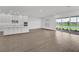 Open-concept living and kitchen with a view of the water and landscape at 17911 Palmiste Dr, Bradenton, FL 34202