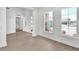 Living room with hardwood floors, white walls, and lots of natural light at 17911 Palmiste Dr, Bradenton, FL 34202