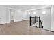 Open loft area with wood floors, staircase, and ample natural light from multiple windows at 17911 Palmiste Dr, Bradenton, FL 34202