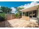 Private brick-paved backyard with tropical landscaping at 1869 Springbush Ln, Clearwater, FL 33763