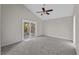 Large bedroom with a sliding glass door that provides access to an outdoor patio or balcony at 1869 Springbush Ln, Clearwater, FL 33763