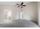 Spacious bedroom featuring a ceiling fan and access to a bathroom and other rooms at 1869 Springbush Ln, Clearwater, FL 33763