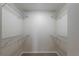 Spacious walk-in closet featuring wire shelving for optimal storage at 1869 Springbush Ln, Clearwater, FL 33763