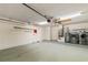 Attached garage with updated lighting, washer, dryer, and plenty of storage at 1869 Springbush Ln, Clearwater, FL 33763