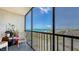 Relaxing screened balcony with seating area and panoramic ocean view at 2045 Gulf Of Mexico Dr # M1-514, Longboat Key, FL 34228
