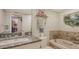 Bathroom features a bathtub, granite countertop, toilet, and vanity at 2045 Gulf Of Mexico Dr # M1-514, Longboat Key, FL 34228