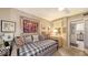 Bedroom features a built-in wall unit and mirrored closet doors, with space-saving daybed and natural light at 2045 Gulf Of Mexico Dr # M1-514, Longboat Key, FL 34228