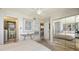 Bright bedroom features mirrored wall, ceiling fan, ensuite bathroom access, and lots of natural light at 2045 Gulf Of Mexico Dr # M1-514, Longboat Key, FL 34228