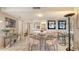 Inviting dining area with tile flooring and views into the kitchen at 2045 Gulf Of Mexico Dr # M1-514, Longboat Key, FL 34228