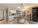Cozy dining area adjacent to the kitchen with seating for four at 2045 Gulf Of Mexico Dr # M1-514, Longboat Key, FL 34228