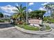 Well-manicured entrance to Seaplace, featuring lush landscaping and clear signage at 2045 Gulf Of Mexico Dr # M1-514, Longboat Key, FL 34228