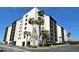 Beautiful condo building featuring tropical landscaping, and ocean views at 2045 Gulf Of Mexico Dr # M1-514, Longboat Key, FL 34228
