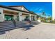 This exterior view showcases building access with tiled steps and a covered entrance at 2045 Gulf Of Mexico Dr # M1-514, Longboat Key, FL 34228
