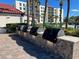 This exterior grilling area features 4 gas grills, perfect for enjoying a barbecue near the pool at 2045 Gulf Of Mexico Dr # M1-514, Longboat Key, FL 34228