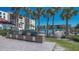 This grilling area features four gas grills for cooking while enjoying the nearby pool and sunshine at 2045 Gulf Of Mexico Dr # M1-514, Longboat Key, FL 34228