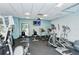 Fitness center with treadmills, stationary bikes, and a mounted television for entertainment at 2045 Gulf Of Mexico Dr # M1-514, Longboat Key, FL 34228