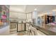 Kitchen features stainless appliances, granite countertops, and breakfast bar seating at 2045 Gulf Of Mexico Dr # M1-514, Longboat Key, FL 34228