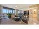 Well-lit living room featuring a balcony and comfortable seating at 2045 Gulf Of Mexico Dr # M1-514, Longboat Key, FL 34228