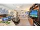 Comfortable living room with mirrored wall and stylish furnishings at 2045 Gulf Of Mexico Dr # M1-514, Longboat Key, FL 34228
