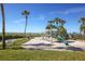 Playground by the beach, featuring a play structure, slide, and swings for outdoor fun at 2045 Gulf Of Mexico Dr # M1-514, Longboat Key, FL 34228