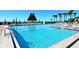 Large community pool with lane markers and plenty of lounge chairs offers a refreshing place to unwind at 2045 Gulf Of Mexico Dr # M1-514, Longboat Key, FL 34228