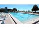 Inviting, large community pool with lounge chairs and umbrellas provides a relaxing atmosphere by the sea at 2045 Gulf Of Mexico Dr # M1-514, Longboat Key, FL 34228