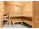 Inviting wooden sauna featuring multiple tiers of seating for a relaxing experience at 2045 Gulf Of Mexico Dr # M1-514, Longboat Key, FL 34228