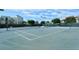 Well-maintained tennis court surrounded by lush landscaping in a vibrant community at 2045 Gulf Of Mexico Dr # M1-514, Longboat Key, FL 34228