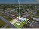 Aerial view of a home highlighting its well-maintained yard, refreshing pool, and solar panels at 212 66Th Avenue W Dr, Bradenton, FL 34207