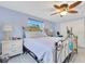 Bright bedroom with ceiling fan, windows, and comfortable bedding, with plenty of space at 212 66Th Avenue W Dr, Bradenton, FL 34207