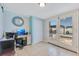 Bright home office with a pool view, work station, tile floors, and access to the outdoors at 212 66Th Avenue W Dr, Bradenton, FL 34207