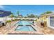 Backyard pool and patio area featuring a spa and outdoor seating at 212 66Th Avenue W Dr, Bradenton, FL 34207