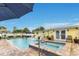 Backyard featuring pool, spa, patio, and lush landscaping at 212 66Th Avenue W Dr, Bradenton, FL 34207